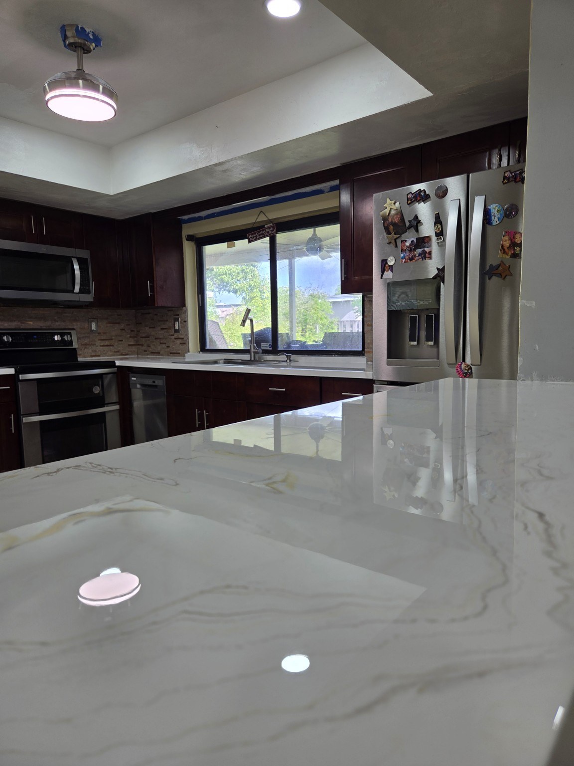 Dark cabinet kitchen with white and gold epoxy finish