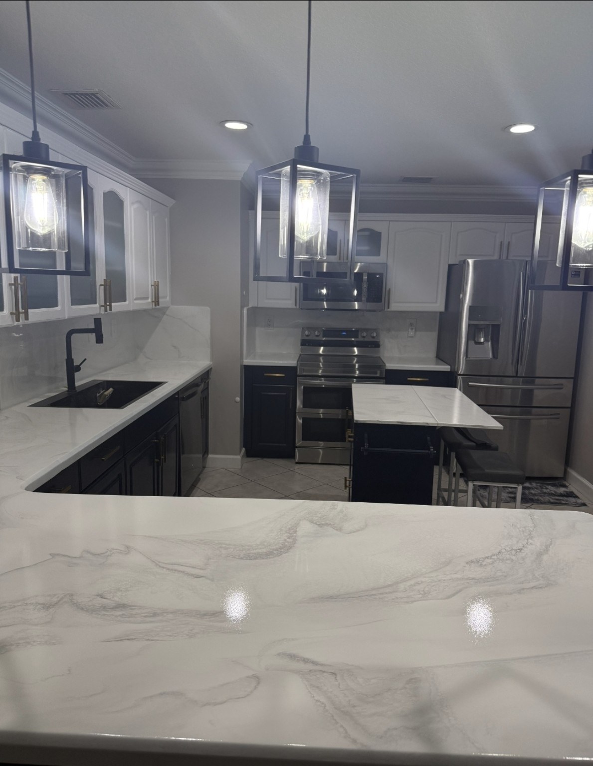 Angle view of dark kitchen and glossy epoxy countertop